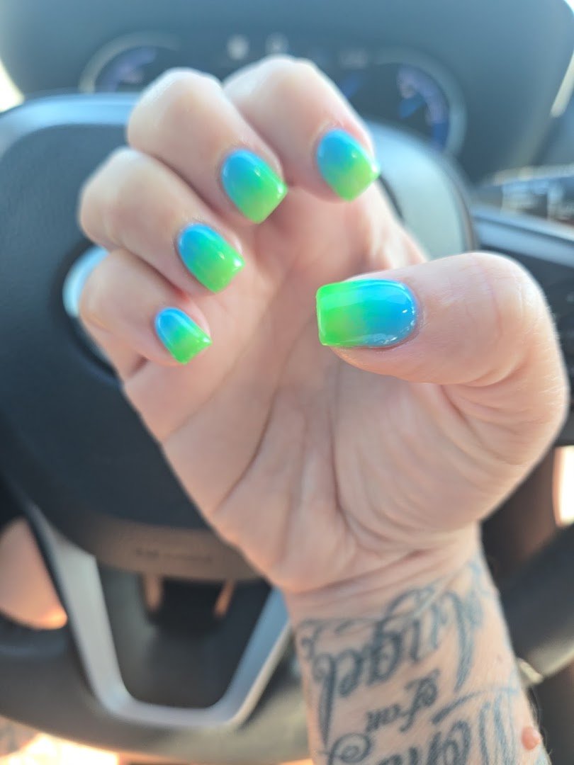 Manicured hands with glossy nail polish